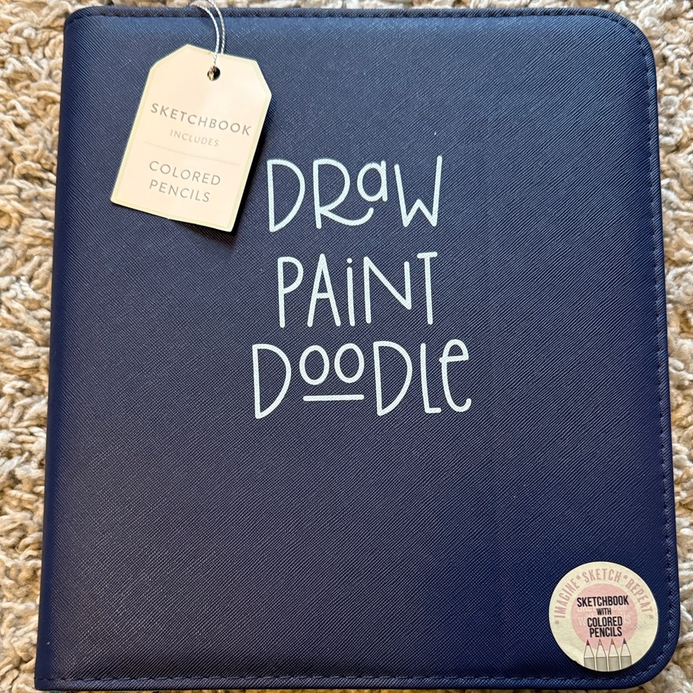 Blue Sketchbook with Colored Pencils